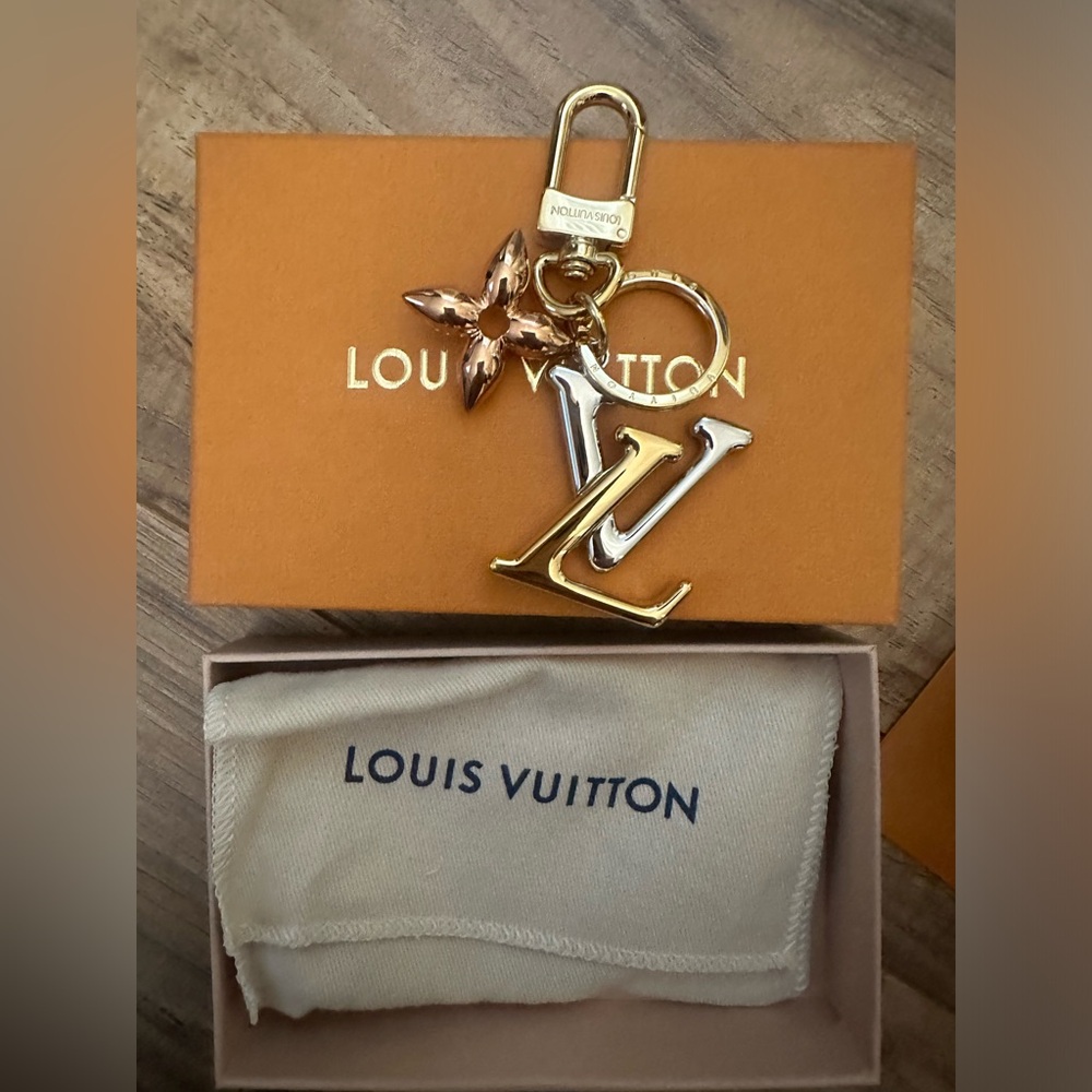 Louis Vuitton key chain/ bag charm brand new never used with receipt!